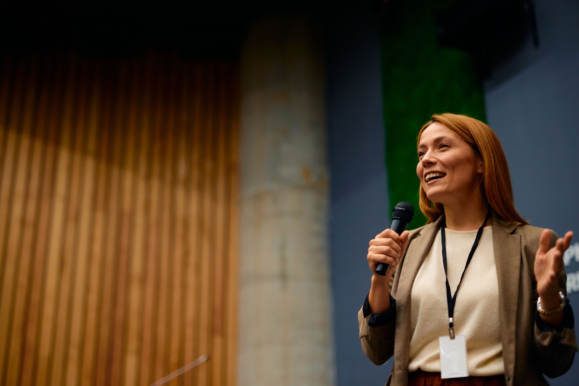 Confident speaker inspiring audience at business conference